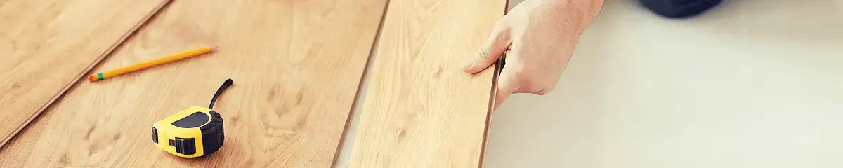 A professional installing wood flooring in Tacoma, WA