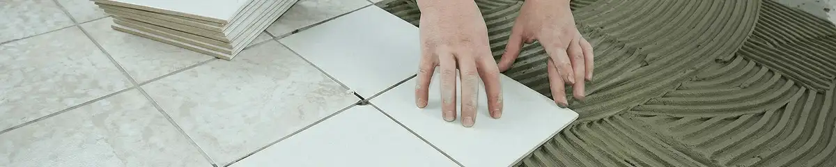 Professional installing white tile floors in Tacoma, WA