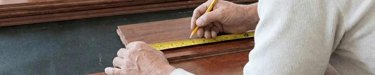 A professional installing wood flooring in Tacoma, WA